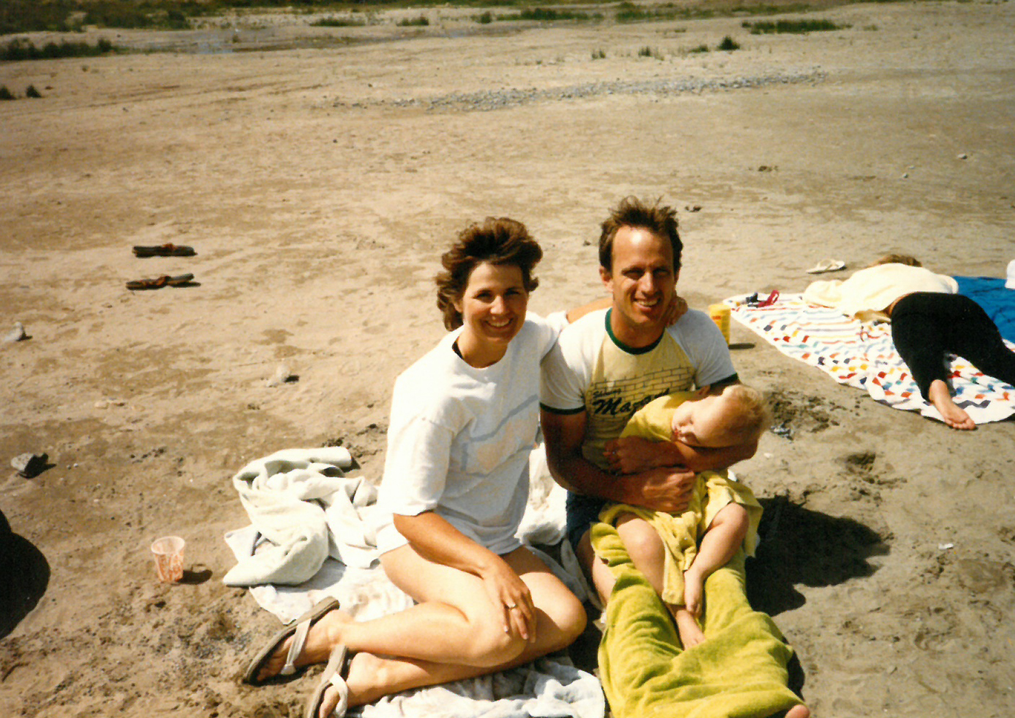 Vern and Nanette Garrett carrying their son