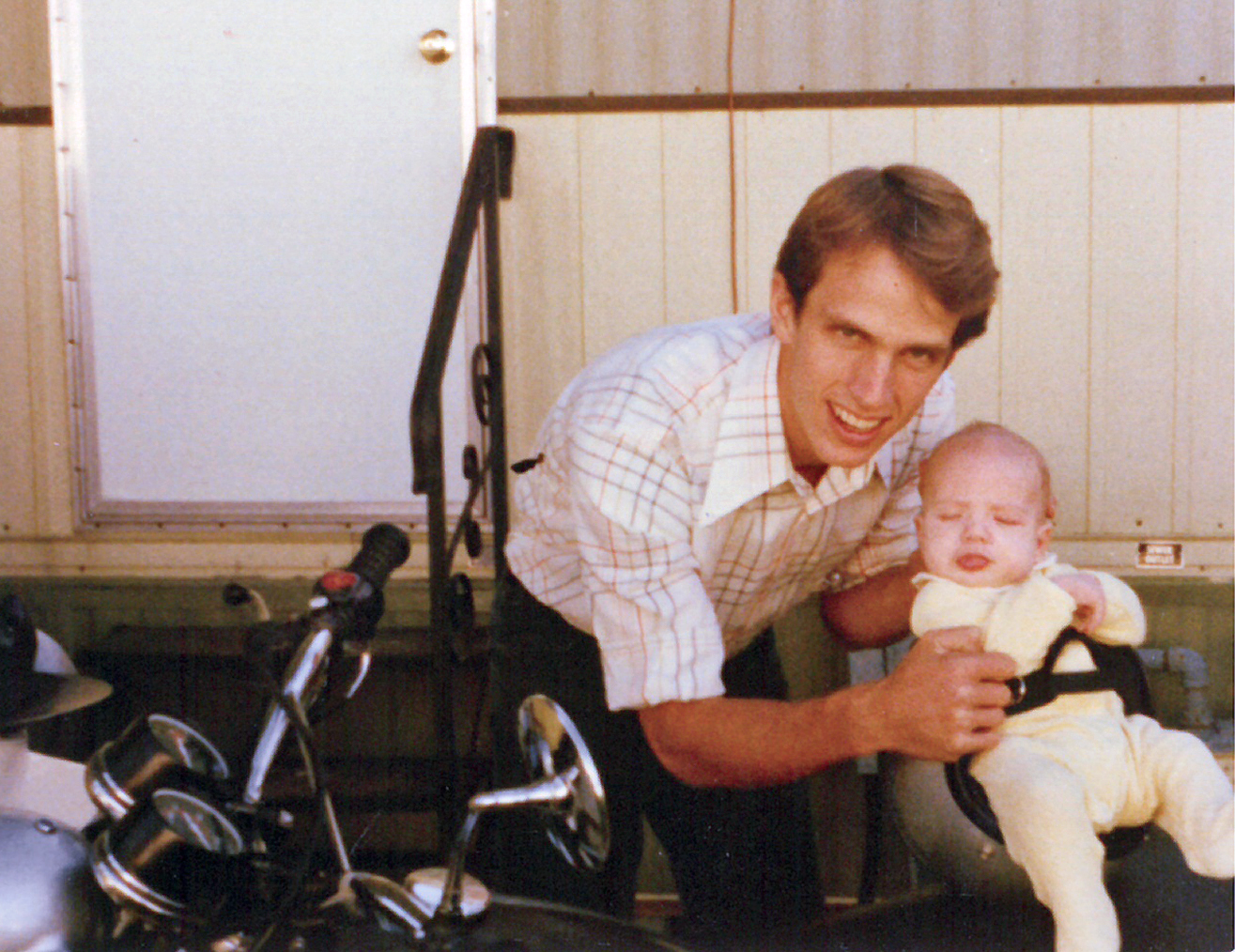 Vern and Brennon on a motorcycle CC